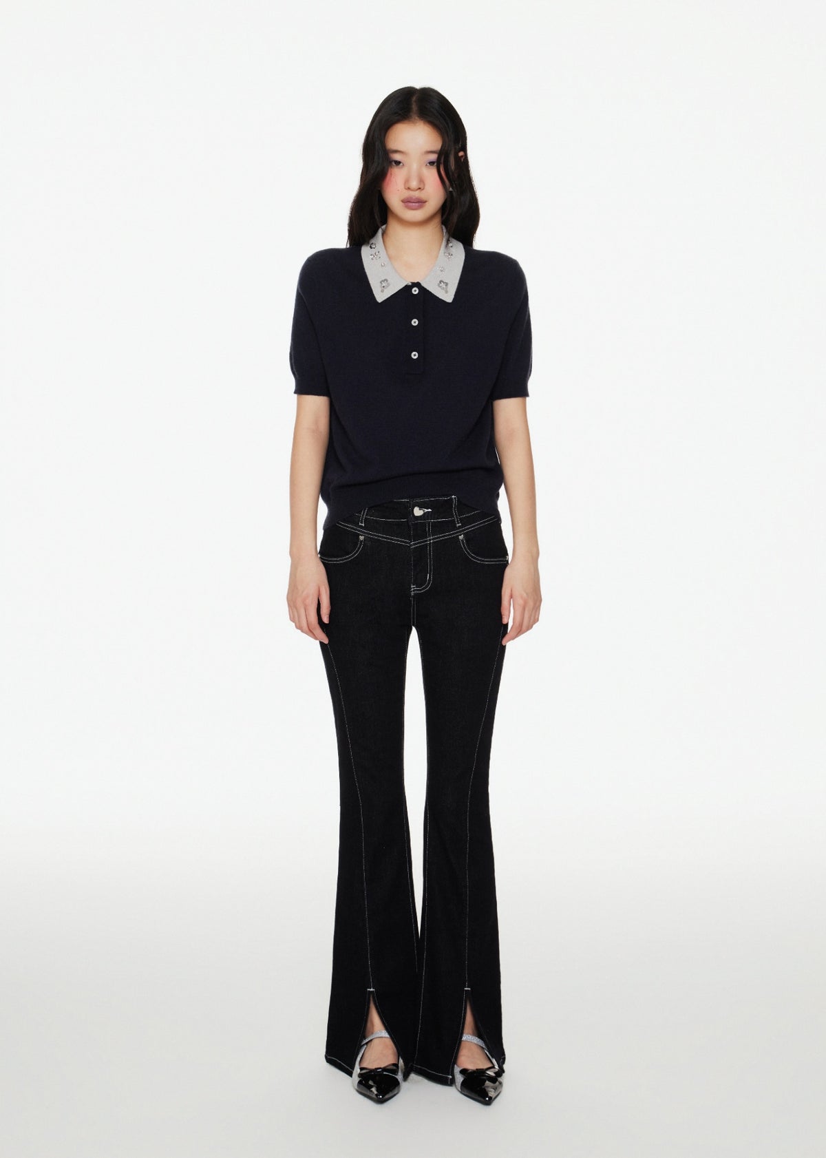 A model wearing Black Bootcut Jeans