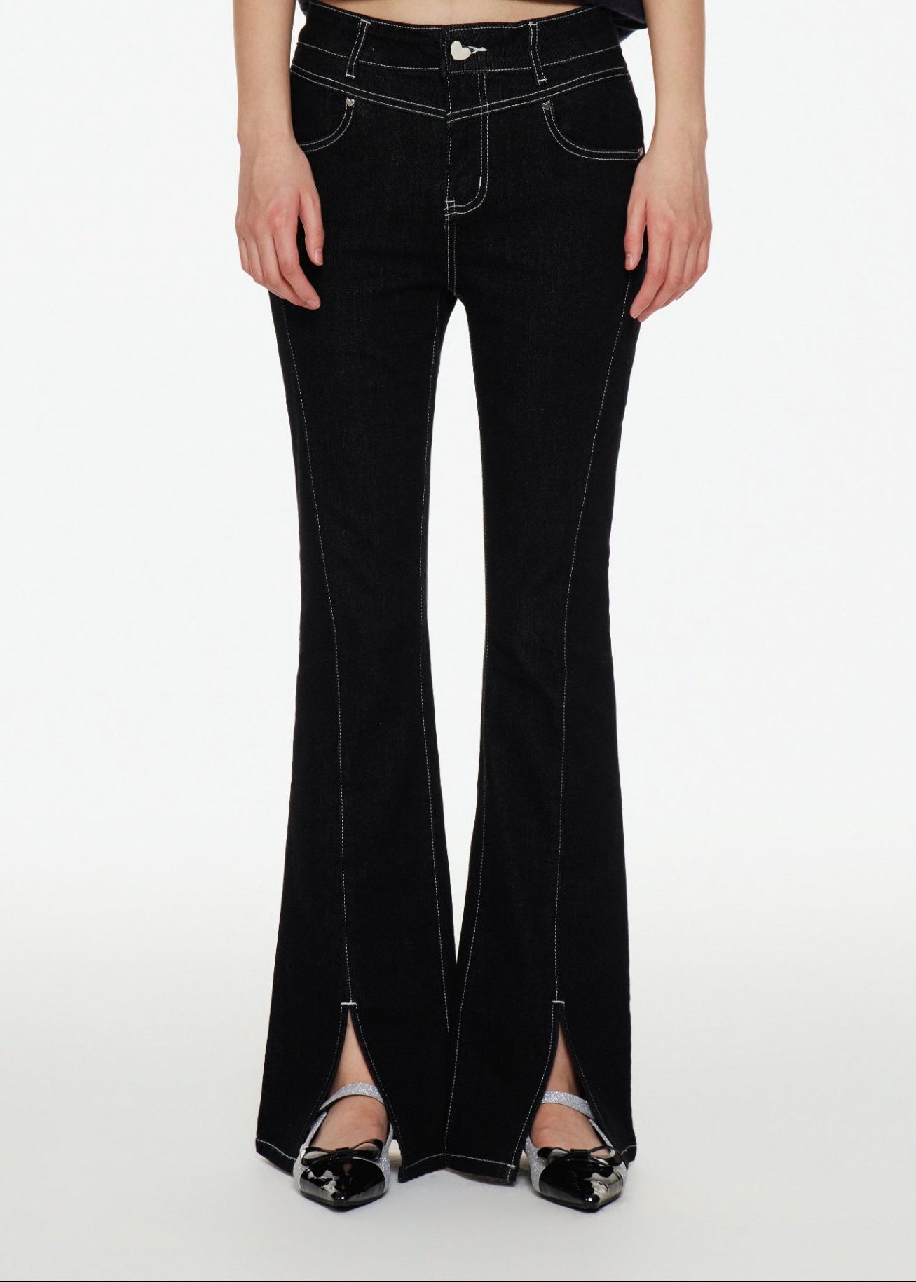 Close-up of a model wearing Black Bootcut Jeans